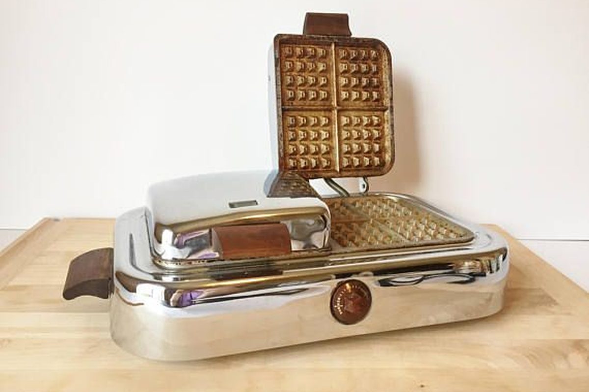 A vintage waffle iron, where the waffle sole began