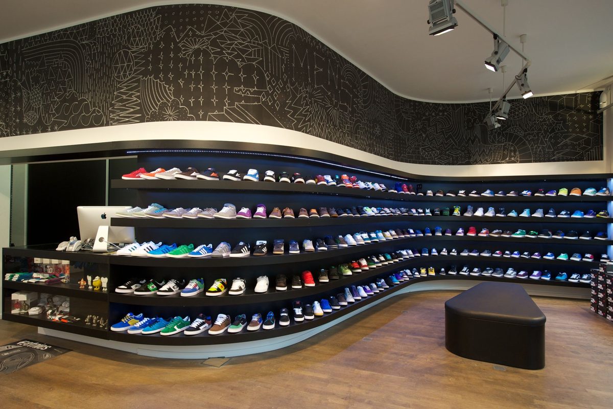 Shelves of trainers in a shop